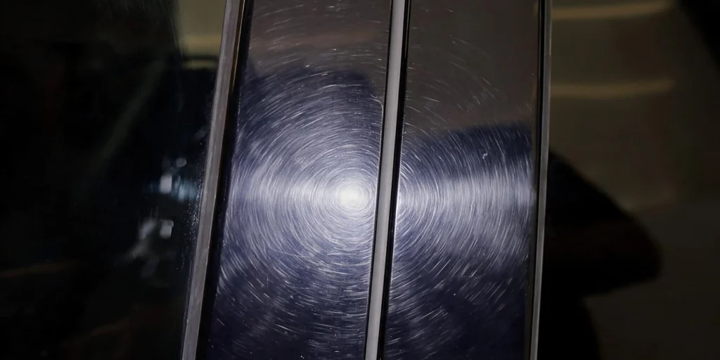 Swirl marks on a black painted surface