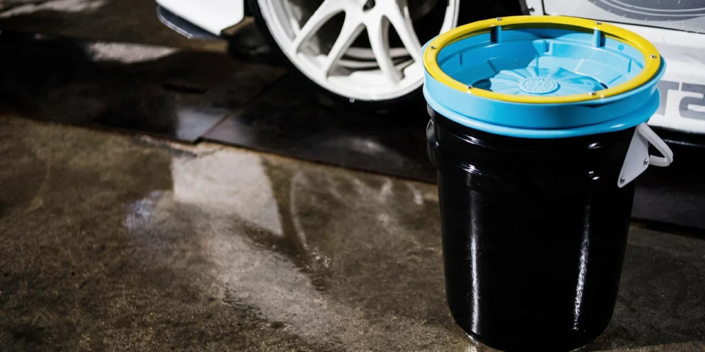 The Lake Country System 4000 Pad Washer sitting next to a vehicle
