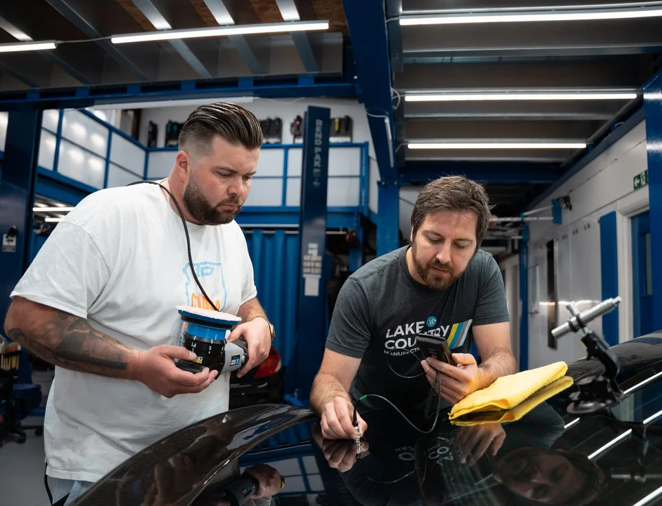 Detailers reviewing polishing results during a Lake Country training session