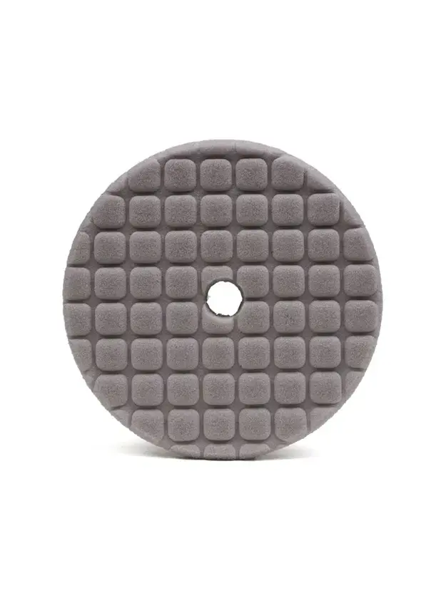 Grey ARC heavy correcting foam pad with a precision cutaway profile for consistent contact across curved and contoured surfaces.
